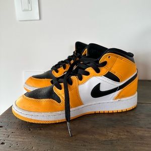 Youth size 4.5 NIKE Air Jordans in black and yellow